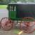 A view of the driver side - The wagon has sliding side doors & convertible windows just as in an Amish buggy.  The wagon also has the orginal working tailgate & a rear door that is supported by hinges.